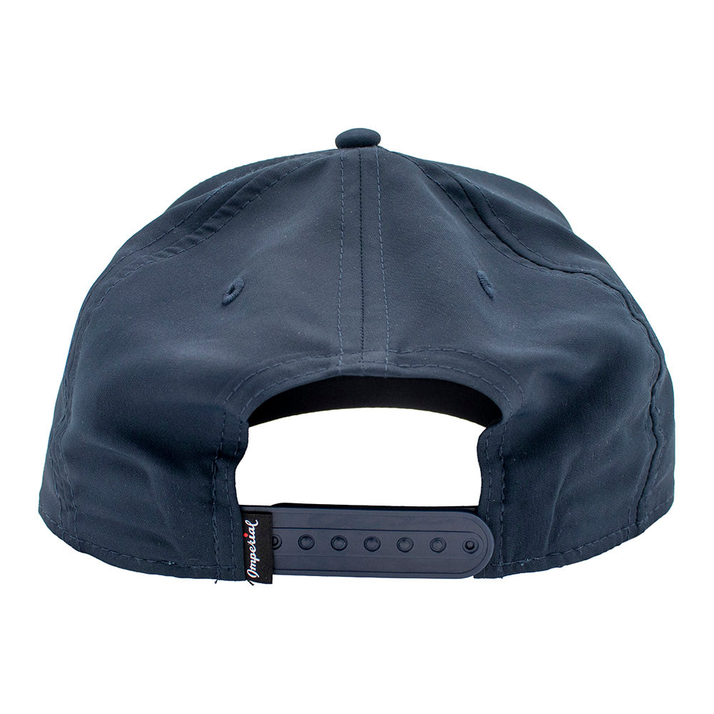 Navy blue cap with a brand tag and a snap back closure.